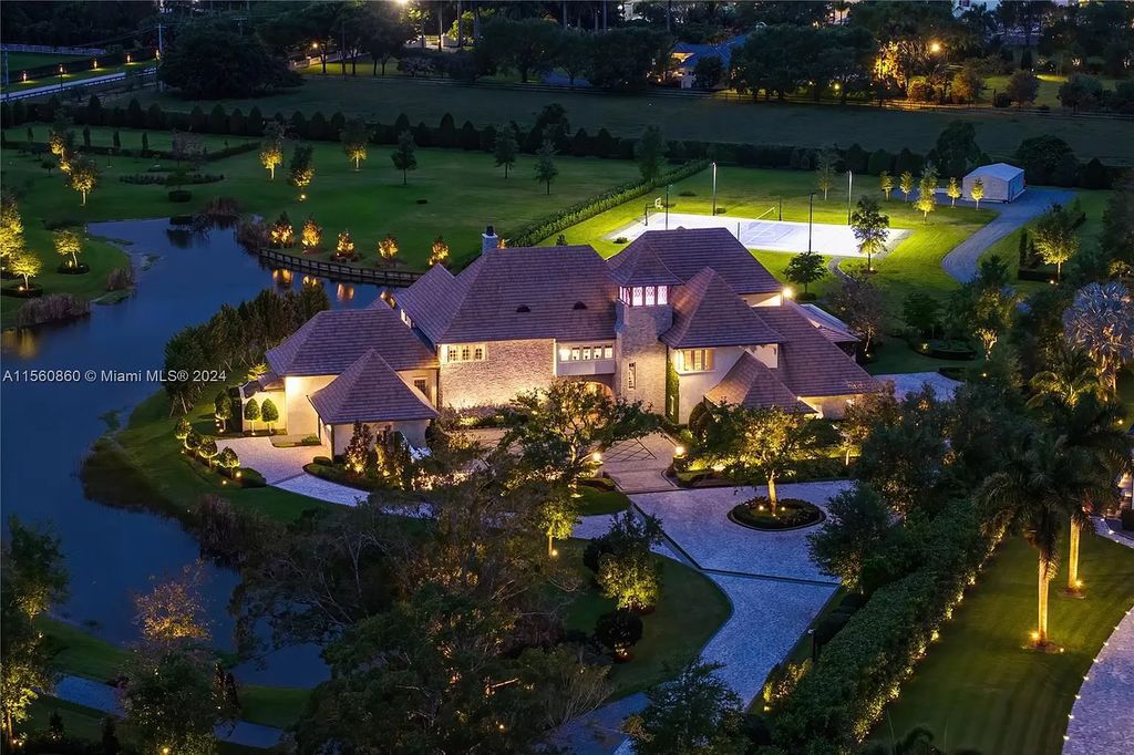 Indulge in the pinnacle of luxury with this custom French Country style mansion in Southwest Ranches, boasting over 15,000 square feet of meticulously crafted living space.