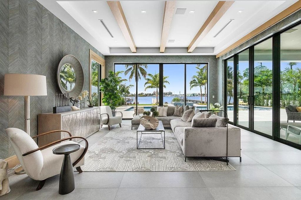Nestled on prestigious Hypoluxo Island, 807 N Atlantic Dr is a captivating ultra-modern waterfront estate offering 5 bedrooms, 6.5 bathrooms, and over 5,000 square feet of luxurious living space.