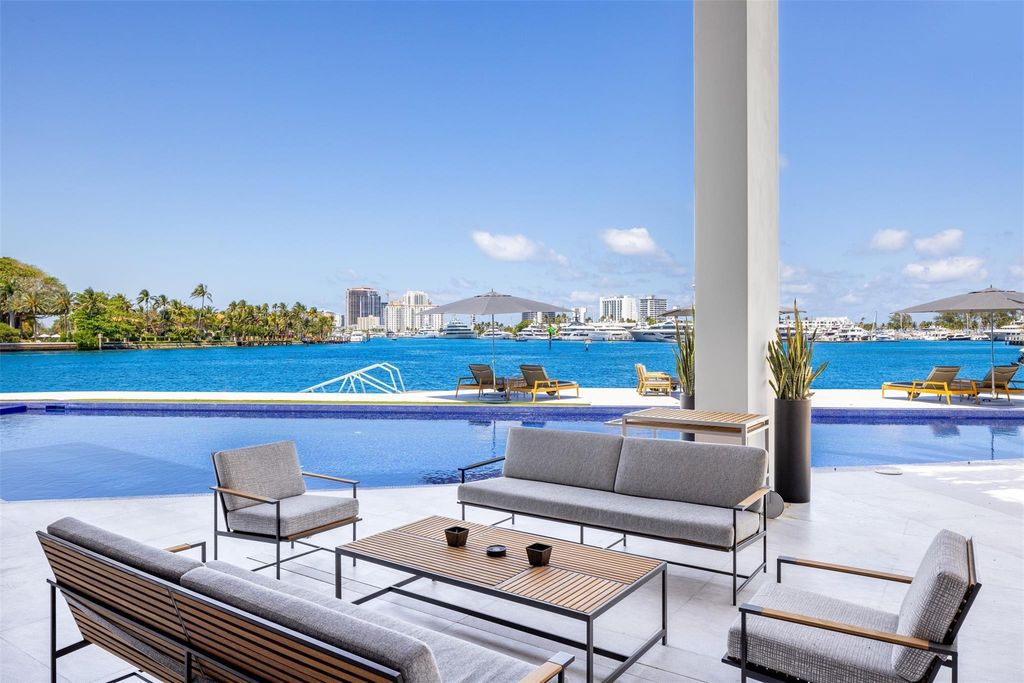 Experience the epitome of luxury living in Fort Lauderdale's prestigious Harbor Beach enclave with this exquisite estate boasting stunning Intracoastal views and 298 feet of water frontage.
