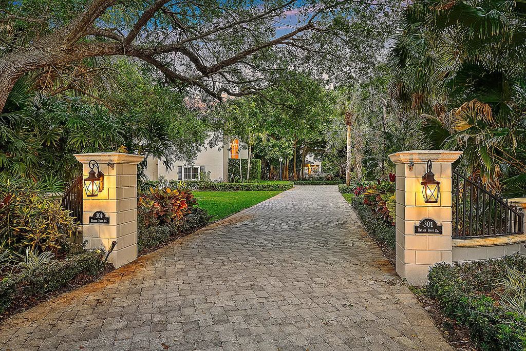 Embrace a lifestyle of luxury and tranquility at 301 SE Harbor Point Dr in Stuart's prestigious Snug Harbor enclave.