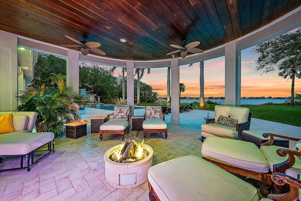 Embrace a lifestyle of luxury and tranquility at 301 SE Harbor Point Dr in Stuart's prestigious Snug Harbor enclave.