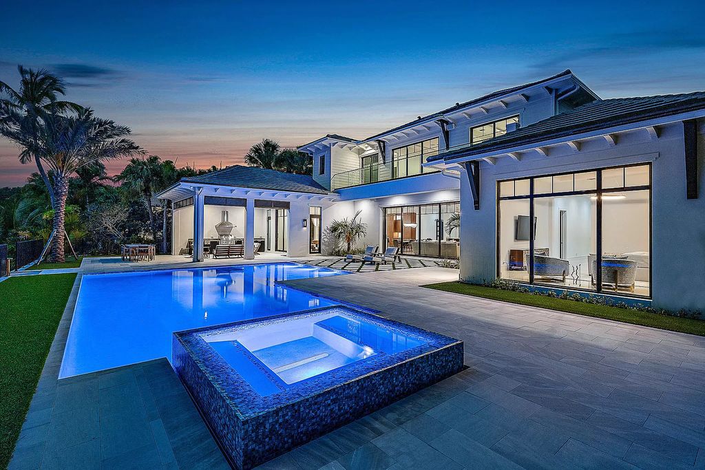 Step into luxury living at 349 Eagle Dr, Jupiter, FL 33477! This newly completed waterfront estate by Hasey Builders boasts 5 en-suite bedrooms, including a lavish primary suite with opulent finishes and stunning water views.