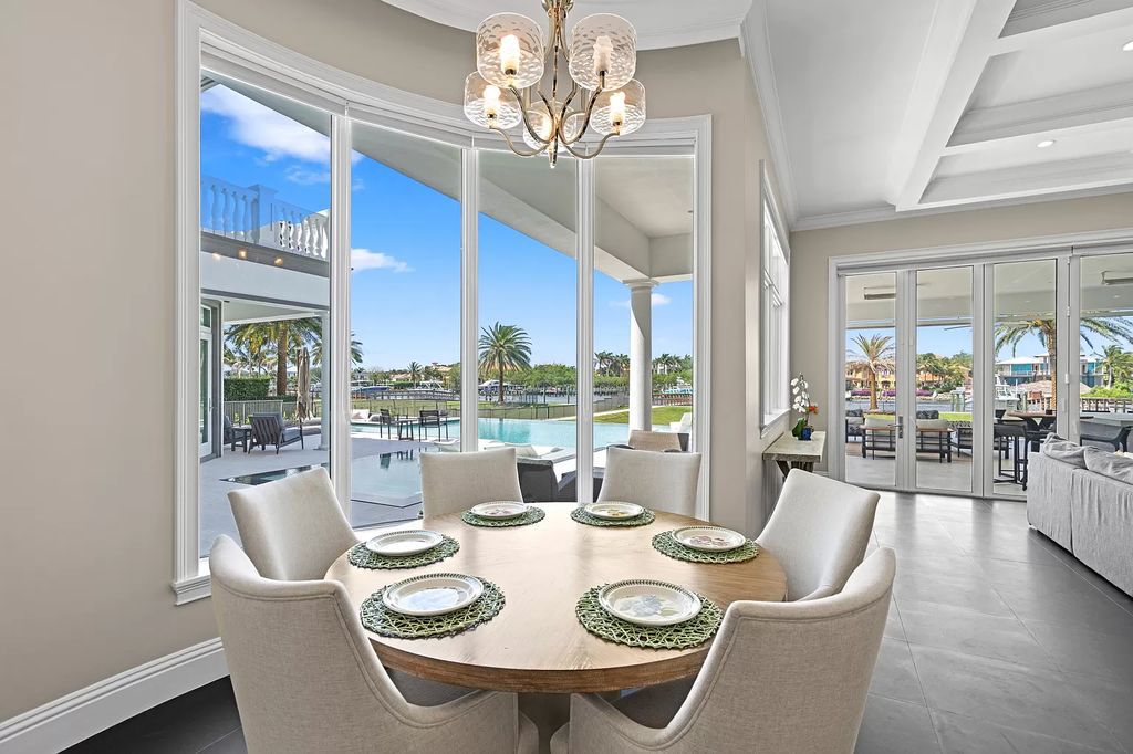 Discover unparalleled luxury living at 13815 Baycliff Drive, North Palm Beach! This custom-built waterfront oasis in the esteemed Frenchman's Harbor community offers over 100 feet of direct intracoastal frontage with a private dock for up to a 70-foot boat, plus a new 4-jet ski lift and platform.