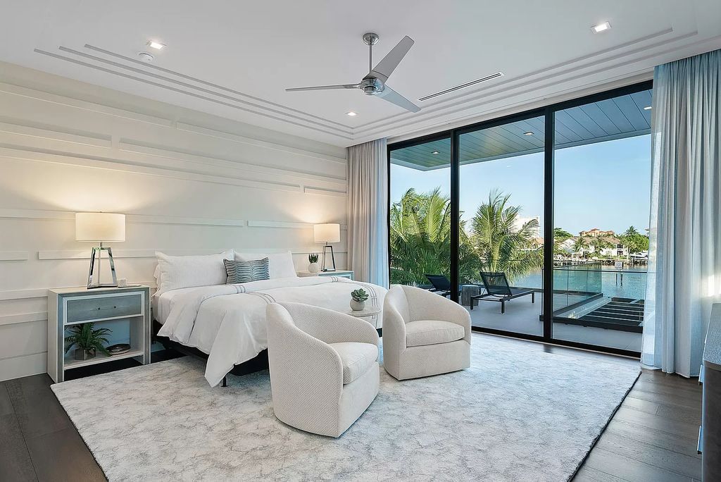 Welcome to 372 E Alexander Palm Rd, a stunning Intracoastal Signature Estate in Boca Raton's Royal Palm Yacht & Country Club crafted by SRD Building Corp.