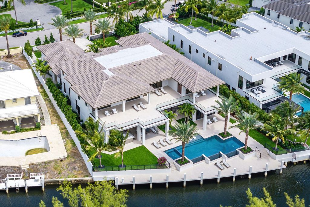 Experience unparalleled luxury at 360 E Alexander Palm Road, a stunning masterpiece by SRD Building Corp in Boca Raton. 