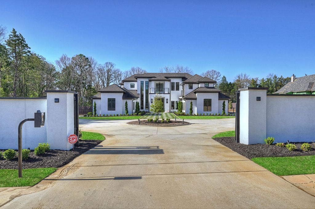3612 English Garden Drive Home in Charlotte, North Carolina. Discover the epitome of modern luxury living in this sleek and spacious 2020-built home set on a sprawling 1.7-acre fenced and gated estate.