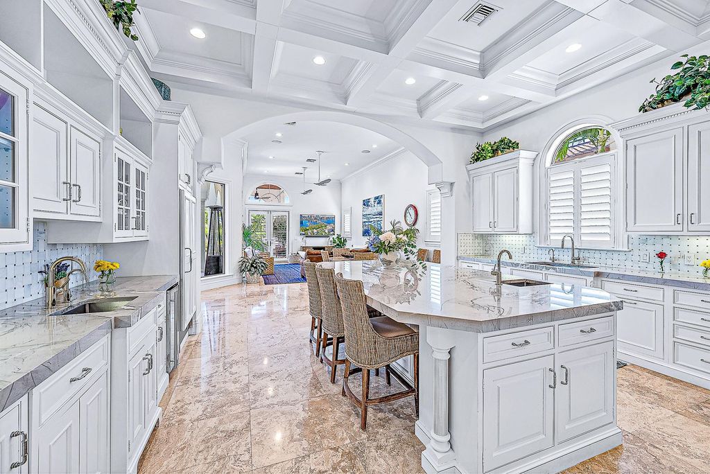 Discover unparalleled luxury at 337 Old Jupiter Beach Road, an exquisite 5-bedroom, 6.5-bathroom waterfront estate in the prestigious Sanctuary Bay neighborhood.