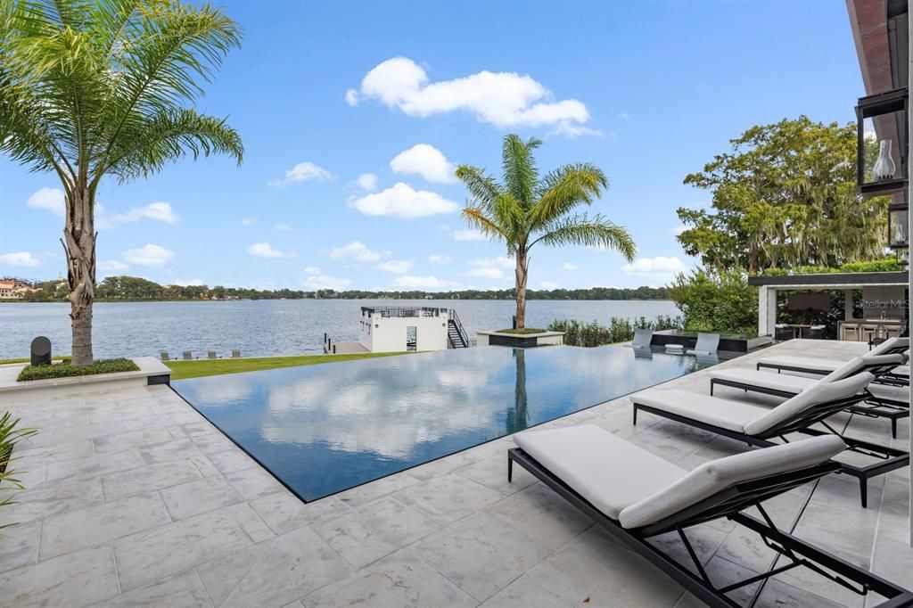 With professional landscaping, a renovated boathouse, and a dock with Trex decking, this property epitomizes waterfront living at 181 Virginia Dr, Winter Park, FL 32789.