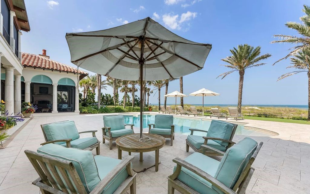 Discover a rare oceanfront gem in Old Ponte Vedra Beach at 75 Ponte Vedra Boulevard. This exquisite 4-bed, 6-bath home, built in 2006, spans 6,557 square feet on a 0.75-acre lot.