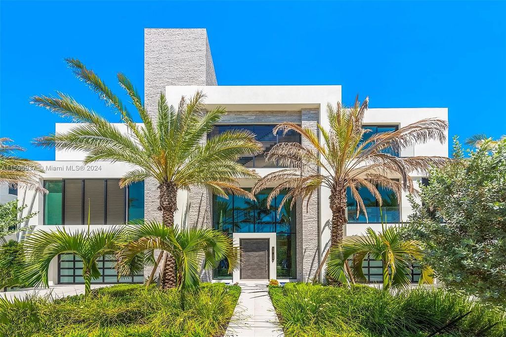 This stunning 7-bedroom, 4-bath estate spans 10,289 sq. ft. on a 0.36-acre lot, with 100 feet of pristine ocean frontage.