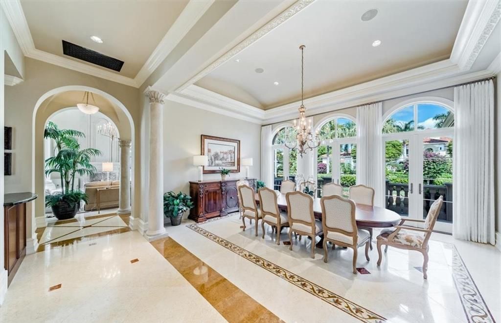 Discover an exquisite 6,500 sq ft single-level home at 2116 Canna Way, Naples, FL, set on a stunning 0.78-acre lot with picturesque lake and golf course views.