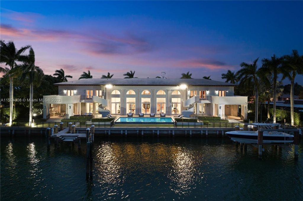 This exceptional property features 7 bedrooms, 2 dens, 8.5 bathrooms, and 225 feet of water frontage. Indulge in premium amenities such as a pool, gym, spa, movie room, and two docks.