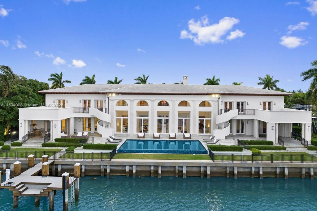 This exceptional property features 7 bedrooms, 2 dens, 8.5 bathrooms, and 225 feet of water frontage. Indulge in premium amenities such as a pool, gym, spa, movie room, and two docks.