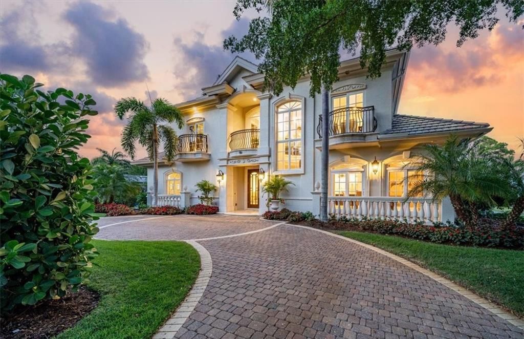 Discover unparalleled luxury living in this meticulously crafted 2-story residence, just moments from the Gulf of Mexico beaches in Naples.