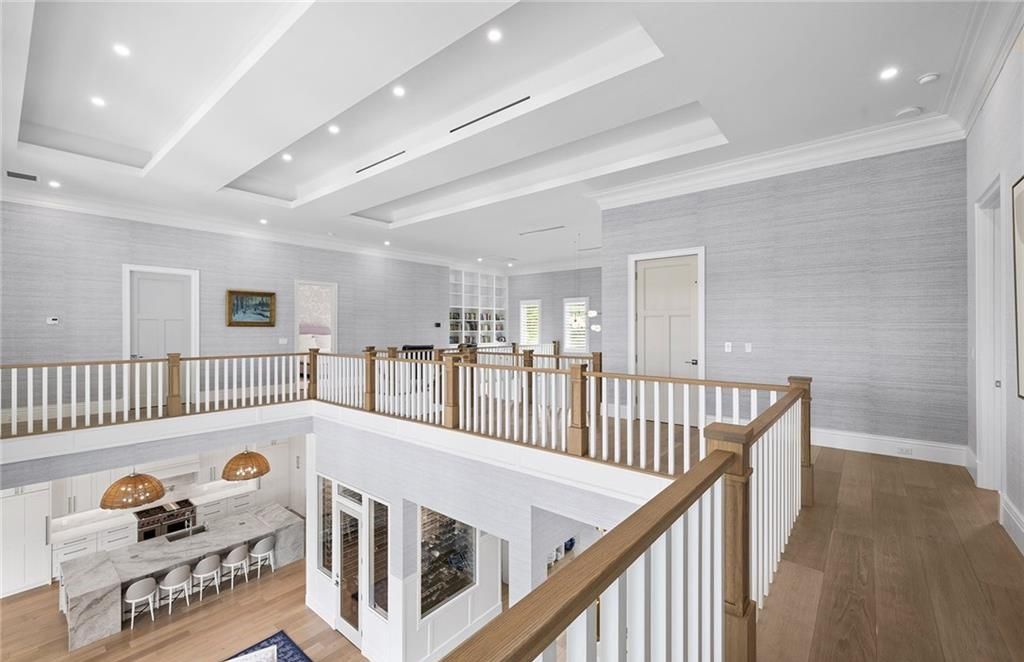 Experience the epitome of luxury living in this timeless yet contemporary Pine Ridge residence, where superior craftsmanship and sustainable design converge on a sprawling 1.72-acre corner lot.