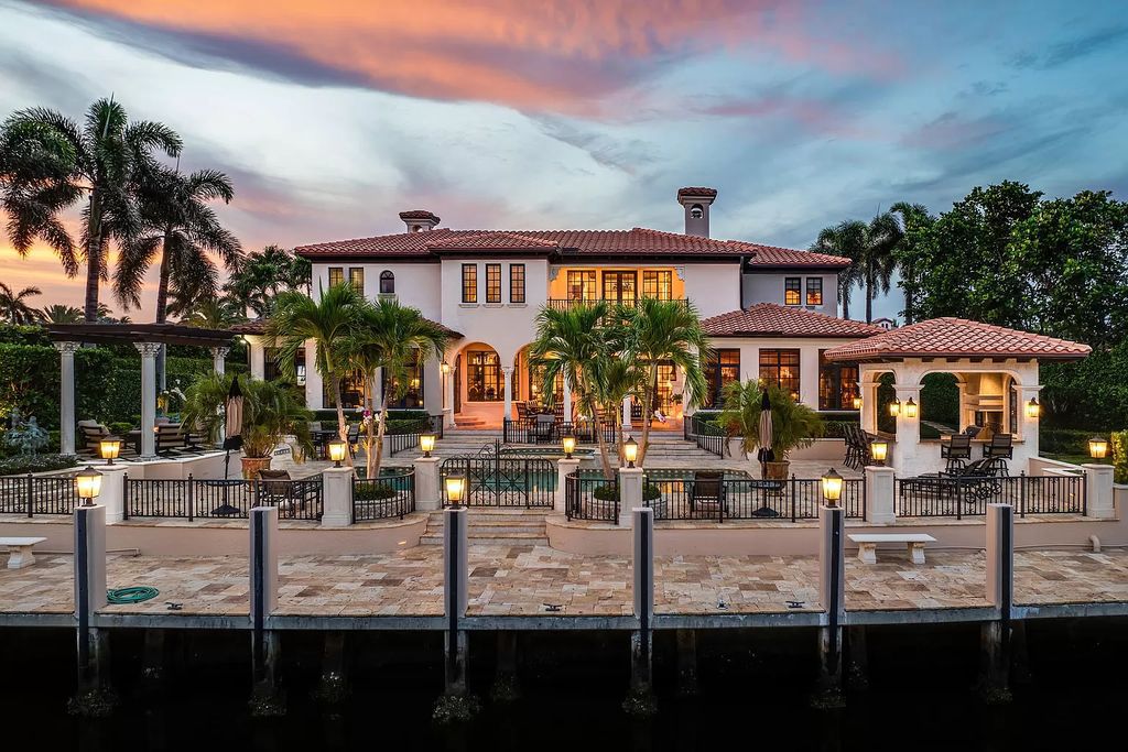 Discover unparalleled luxury at 336 E Coconut Palm Road in the prestigious Royal Palm Yacht & Country Club.