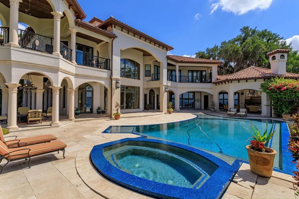 Nestled on 4.743 acres along the Butler Chain of Lakes, this Windermere estate epitomizes luxurious living in Florida. 