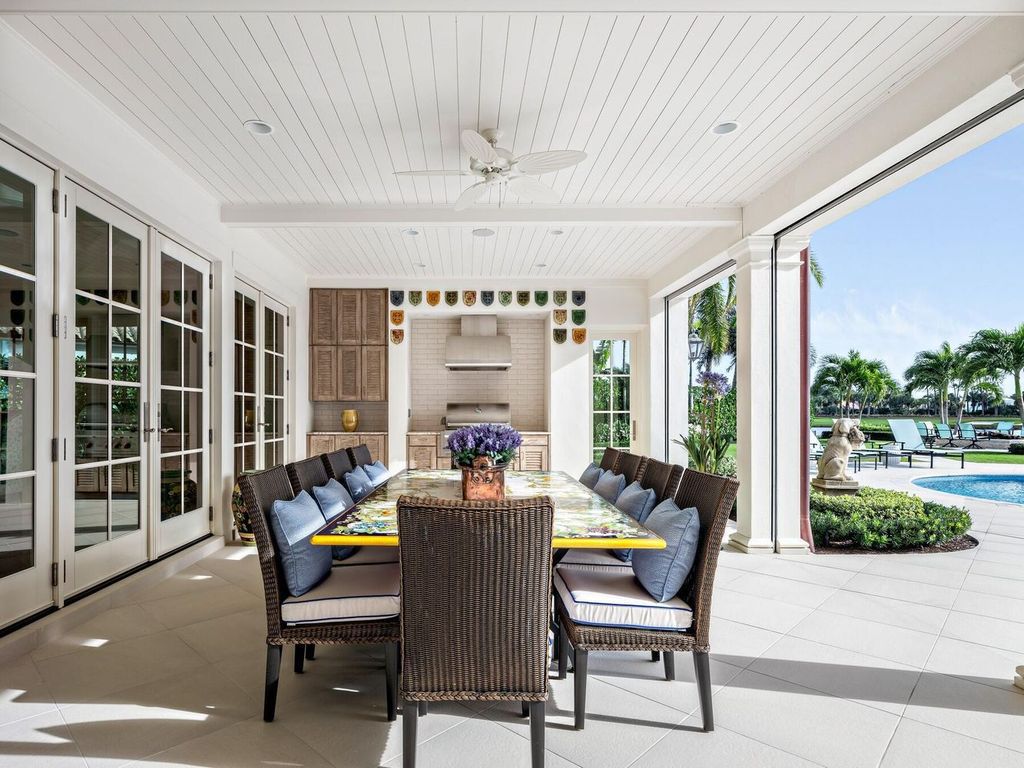 Discover an unparalleled waterfront oasis in the prestigious Loxahatchee Golf Club. This stunning 6,355 square foot single-story estate, masterfully rebuilt in 2020, offers 9,150 square feet of luxurious living space.