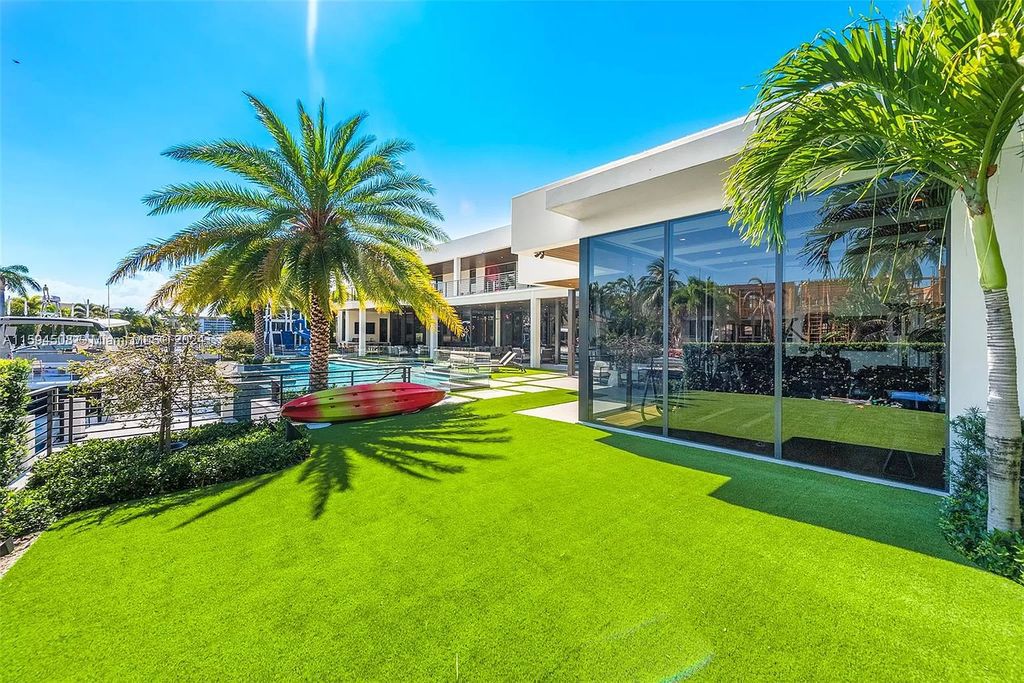 Welcome to 298 W Key Palm Rd, a spectacular newly built waterfront estate by SRD Building Corp. Located in Boca Raton's prestigious Royal Palm Yacht & Country Club, this luxurious home offers over 11,471 square feet of living space on a 26,728 square feet lot.