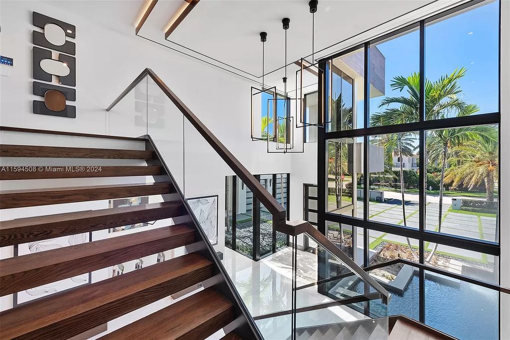 Welcome to 298 W Key Palm Rd, a spectacular newly built waterfront estate by SRD Building Corp. Located in Boca Raton's prestigious Royal Palm Yacht & Country Club, this luxurious home offers over 11,471 square feet of living space on a 26,728 square feet lot.