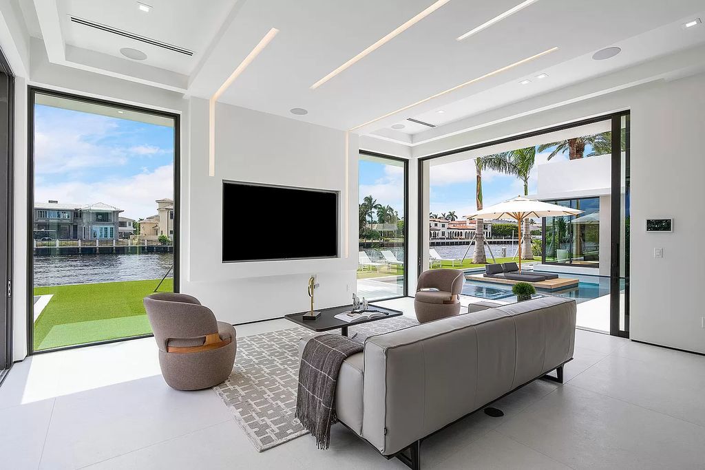 Discover the epitome of Florida living in this modern single-level residence on 109' of Intracoastal waterfront, ideally located near the beach in Boca Raton's Estates Section.