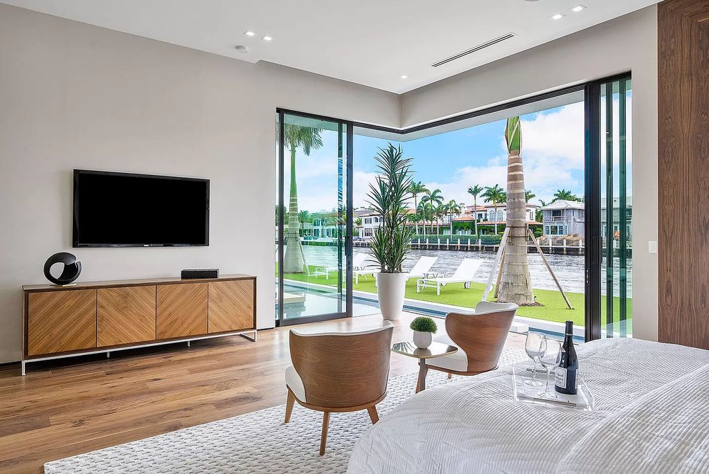 Discover the epitome of Florida living in this modern single-level residence on 109' of Intracoastal waterfront, ideally located near the beach in Boca Raton's Estates Section.