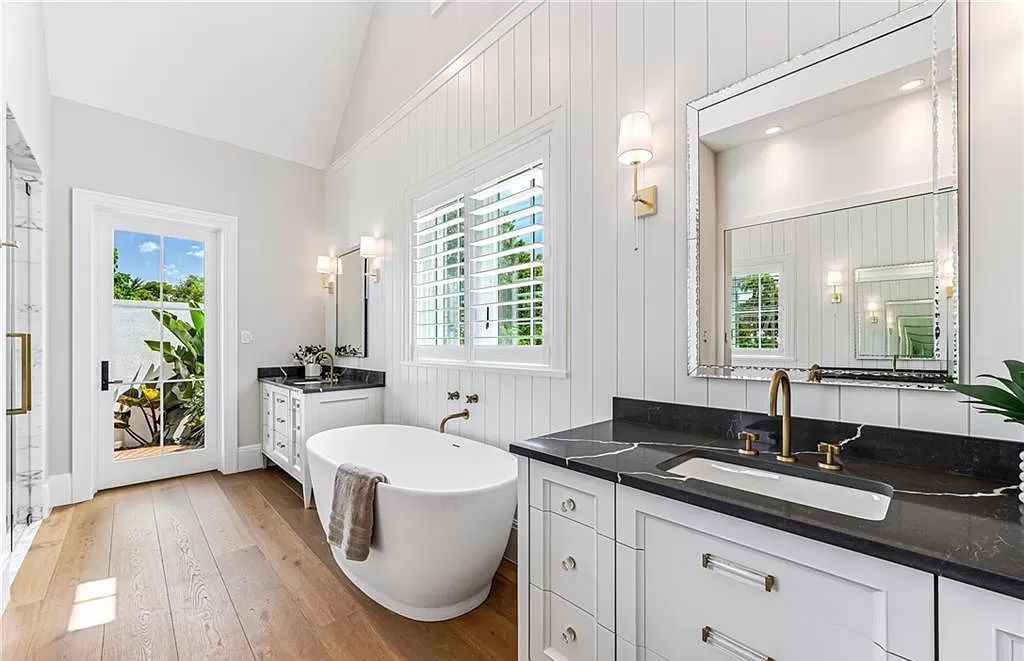Experience luxury in this modern farmhouse at 712 Killdeer Pl, Naples, Florida. Built by the award-winning Van Emmerik Custom Homes, this 6,500 square feet home features high ceilings, beautiful millwork, and premium finishes.