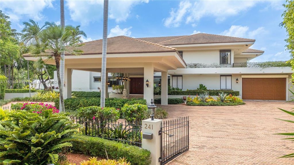 A spectacular 8-bed, 9-bath contemporary home at 241 Cape Florida Dr, Key Biscayne, Florida 33149.