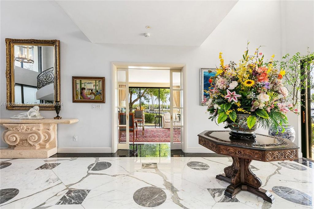 A spectacular 8-bed, 9-bath contemporary home at 241 Cape Florida Dr, Key Biscayne, Florida 33149.