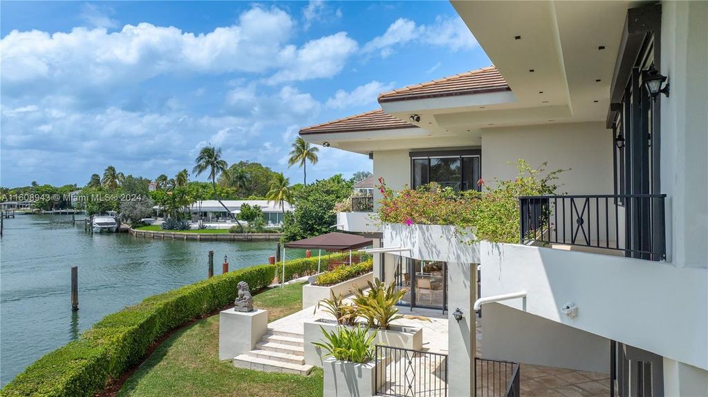 A spectacular 8-bed, 9-bath contemporary home at 241 Cape Florida Dr, Key Biscayne, Florida 33149.