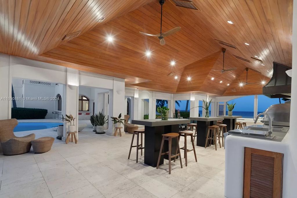 This 11,599 square feet estate on a 41,750 square feet lot includes 150 feet of private ocean frontage.