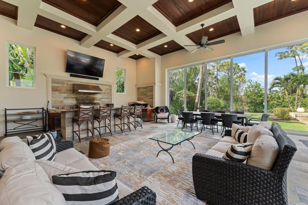 Welcome to 107 W Bears Club Dr, an exquisite custom-built estate in the exclusive Bears Club community in Jupiter, Florida.