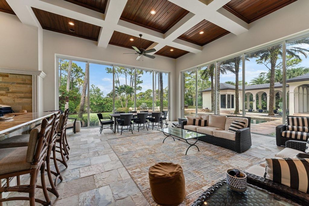 Welcome to 107 W Bears Club Dr, an exquisite custom-built estate in the exclusive Bears Club community in Jupiter, Florida.
