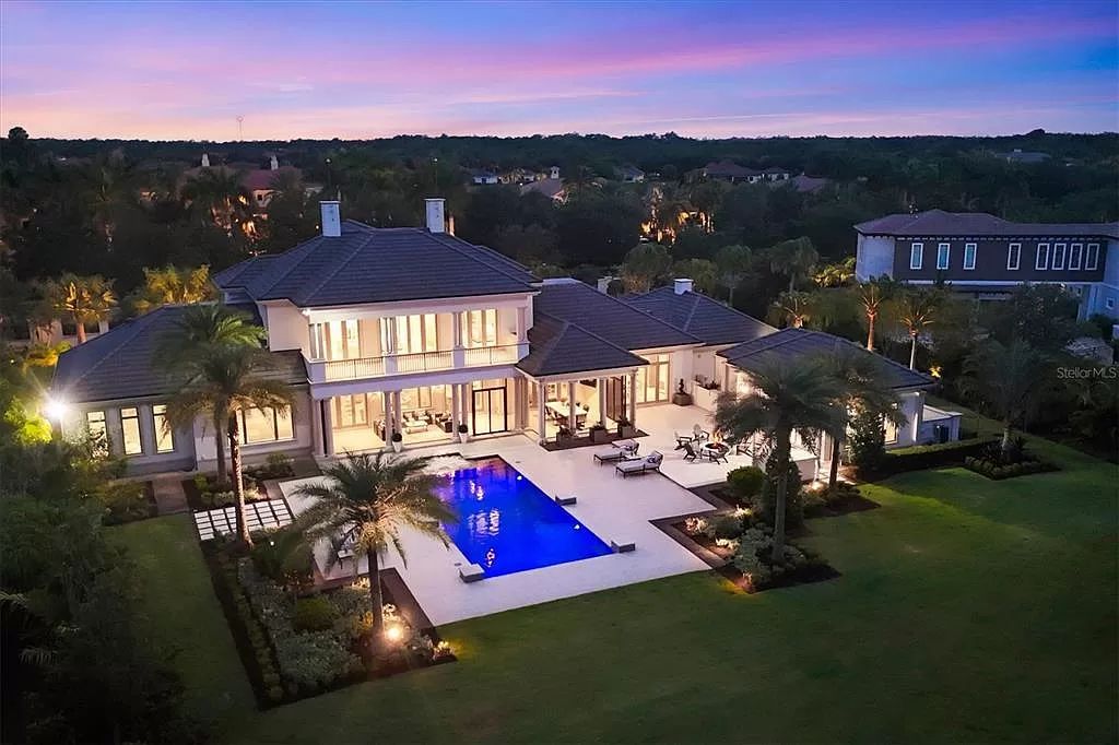 Welcome to 20819 Parkstone Terrace, a residence of unparalleled elegance in Lakewood Ranch, Florida. This 5-bedroom, 5 1/2-bath home, including a guest casita, has been featured on the cover of Home and Design Magazine and represents a pinnacle of luxurious living