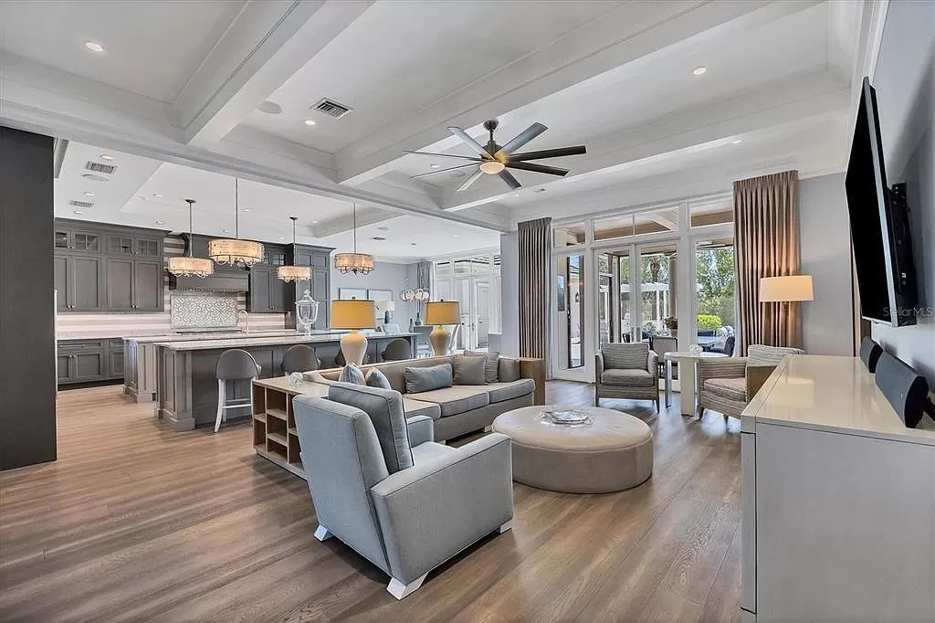Welcome to 20819 Parkstone Terrace, a residence of unparalleled elegance in Lakewood Ranch, Florida. This 5-bedroom, 5 1/2-bath home, including a guest casita, has been featured on the cover of Home and Design Magazine and represents a pinnacle of luxurious living