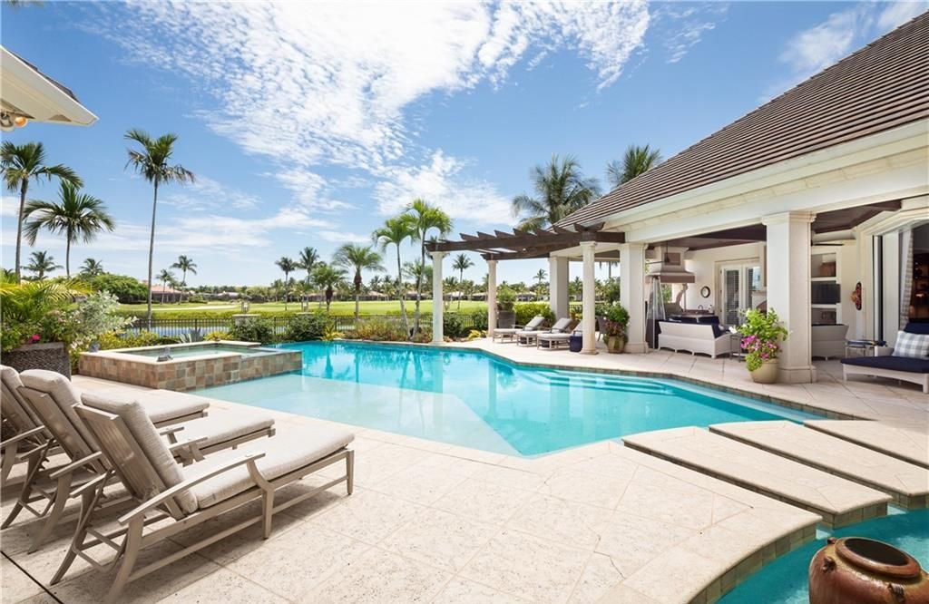 Perfectly located on one of Grey Oaks' prestigious streets, 2145 Canna Way offers sweeping water and fairway views.