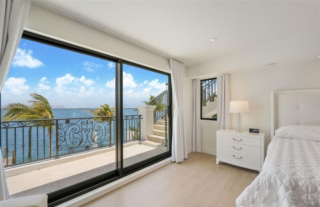 Completely remodeled in 2023, this estate boasts 3,808 SF of modern sophistication and timeless charm. Enjoy unobstructed bay views of Miami Beach, Downtown, and Brickell from the 12,750 square feet lot with 85 feet of bay frontage, perfect for a large boat.