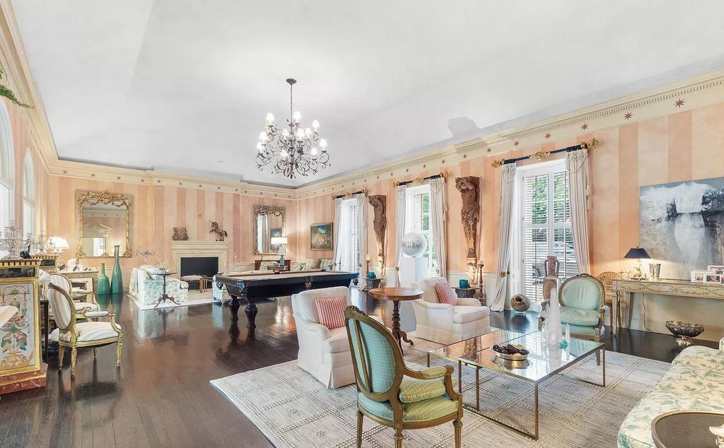 Designed by renowned architect John Volk, this magnificent residence, "The Ballroom," features 6 bedrooms, 6 bathrooms, and 5,612 square feet of living space on a 0.43-acre lot.