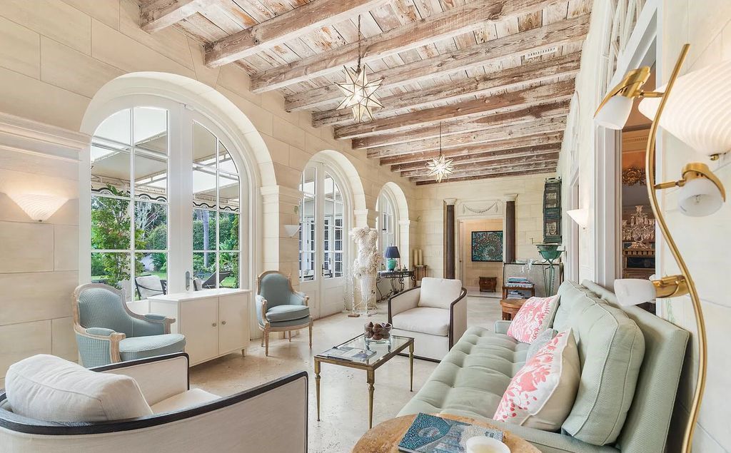 Designed by renowned architect John Volk, this magnificent residence, "The Ballroom," features 6 bedrooms, 6 bathrooms, and 5,612 square feet of living space on a 0.43-acre lot.