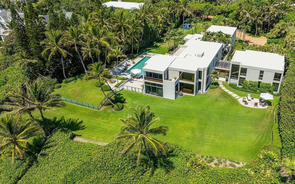Welcome to an exquisite oceanfront estate located in the prestigious Palm Beach, Florida. This stunning property at 1446 N Ocean Blvd offers an unparalleled coastal living experience with 7 bedrooms and 5 bathrooms, spread across a luxurious 8,005 square feet of living space.