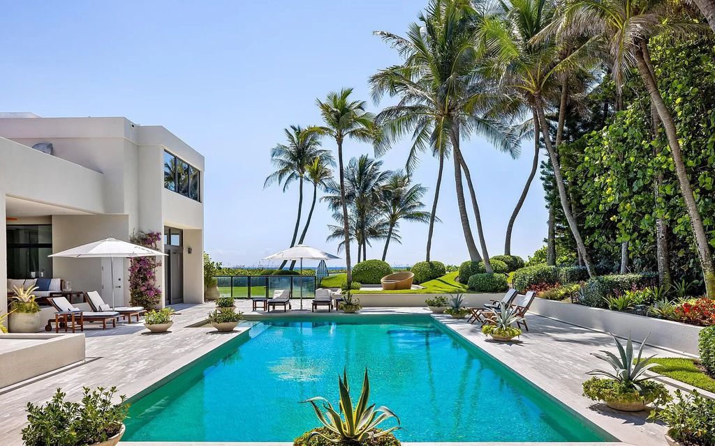 Welcome to an exquisite oceanfront estate located in the prestigious Palm Beach, Florida. This stunning property at 1446 N Ocean Blvd offers an unparalleled coastal living experience with 7 bedrooms and 5 bathrooms, spread across a luxurious 8,005 square feet of living space.