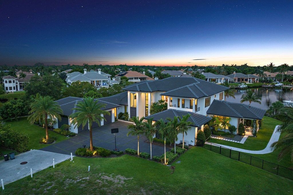 Discover unparalleled luxury in this one-of-a-kind waterfront estate at 18941 SE Reach Island Ln, Jupiter, Florida, nestled in the exclusive, gated community of the Islands of Jupiter.