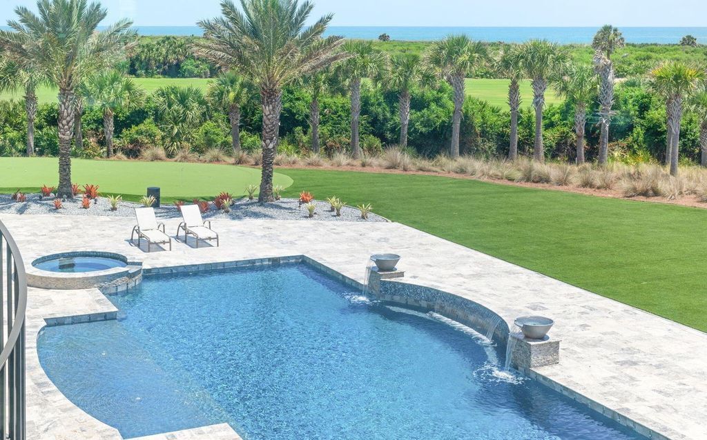 Welcome to the Northshore Retreat at 52 Northshore Drive, Palm Coast, Florida, 9,676 square feet estate on 2.6 acres in an exclusive gated community.