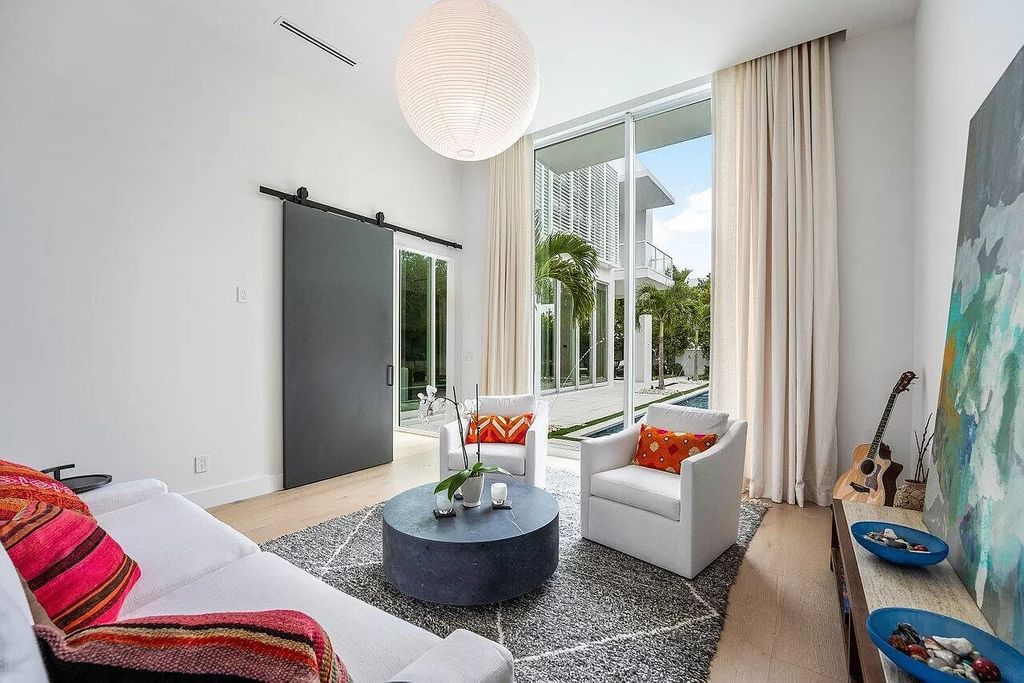 Discover unparalleled luxury at 123 NE 7th Avenue in Delray Beach's Palm Trail, where your private resort awaits.