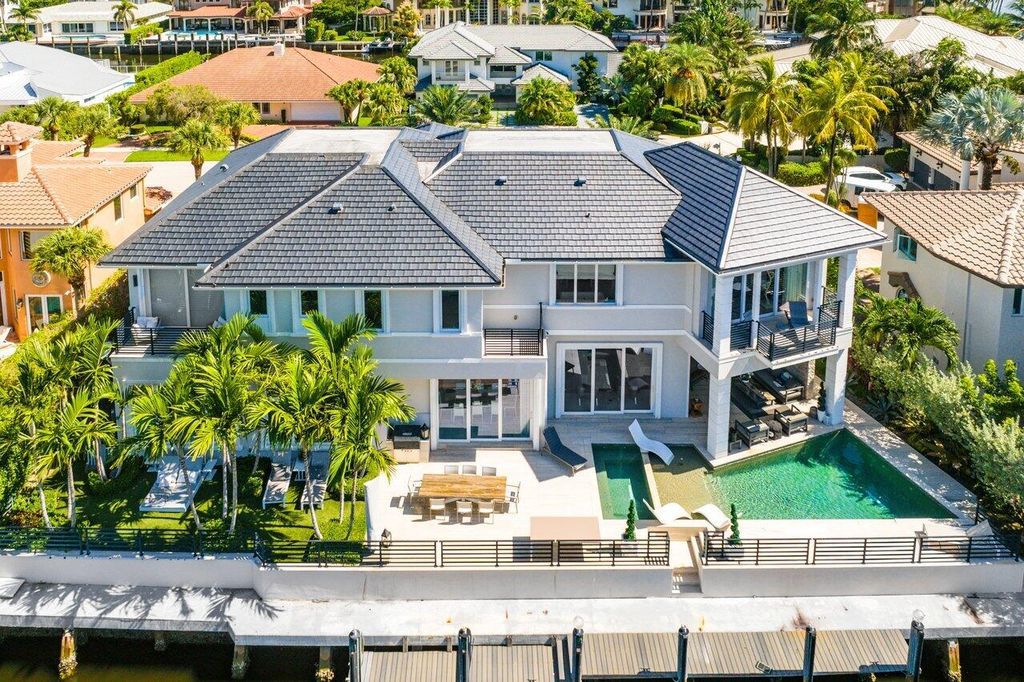 Welcome to 896 Mulberry Drive, a stunning 5 BD, 7 BA estate in the prestigious Walkers Cay/Boca Bay Colony, Boca Raton.