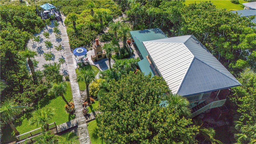 Nestled amid native tropical landscaping, this expansive estate offers a blend of luxury and tranquility. The 1.69-acre estate features a stunning 3,582 square feet main residence with 3 bedrooms and 4 bathrooms, providing ample space for family and guests.