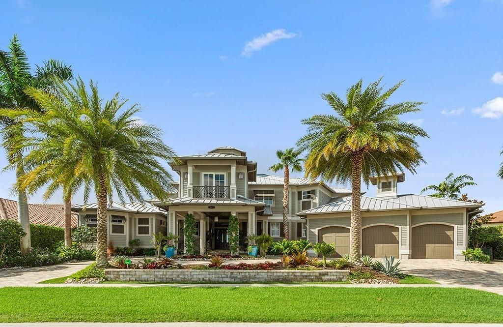 This stunning 7,105 square foot South Florida home, built in 2014 and never before on the market, epitomizes luxury living. Located at 1611 Collingswood Ct, Marco Island, FL 34145, it features 4 bedrooms, 7 bathrooms, a 3-story foyer, office, wine room, and an open concept kitchen.