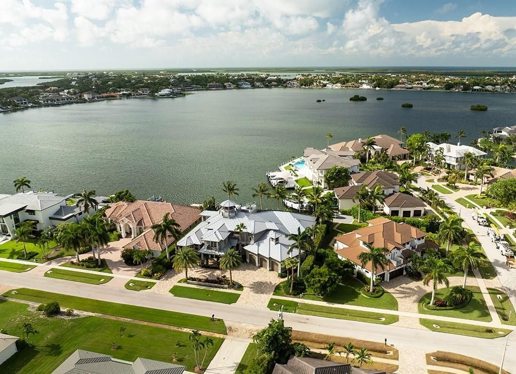 This stunning 7,105 square foot South Florida home, built in 2014 and never before on the market, epitomizes luxury living. Located at 1611 Collingswood Ct, Marco Island, FL 34145, it features 4 bedrooms, 7 bathrooms, a 3-story foyer, office, wine room, and an open concept kitchen.