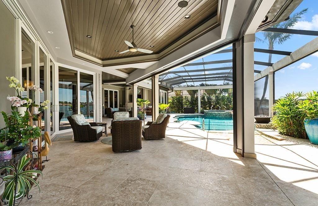 This stunning 7,105 square foot South Florida home, built in 2014 and never before on the market, epitomizes luxury living. Located at 1611 Collingswood Ct, Marco Island, FL 34145, it features 4 bedrooms, 7 bathrooms, a 3-story foyer, office, wine room, and an open concept kitchen.