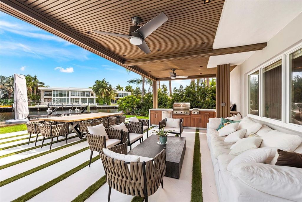 This turnkey 5-bedroom, 4.5-bathroom residence spans 5,549 square feet and boasts 125 feet of prime waterfront on the Intracoastal, perfect for large yachts.